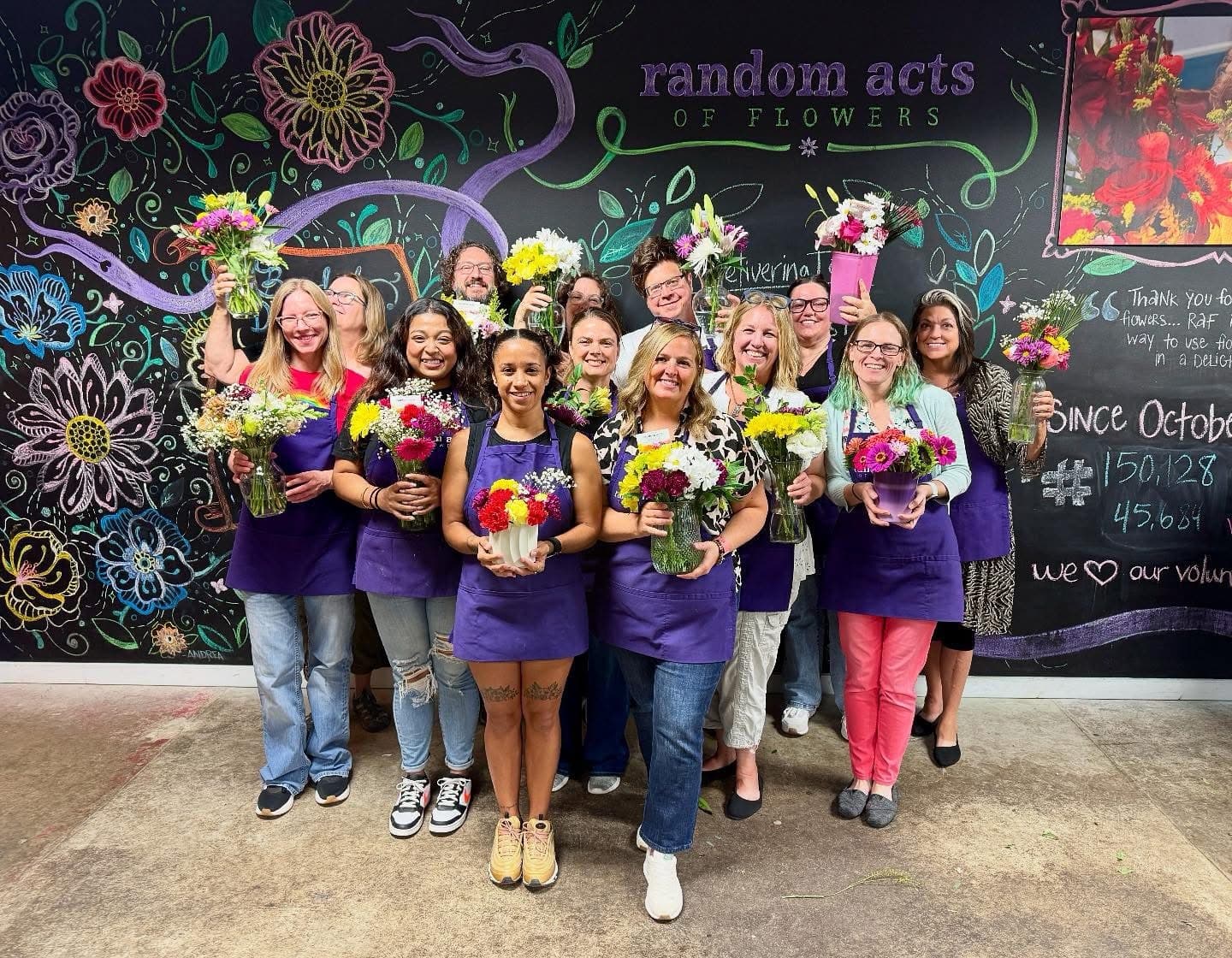 A group of people with flower arrangements