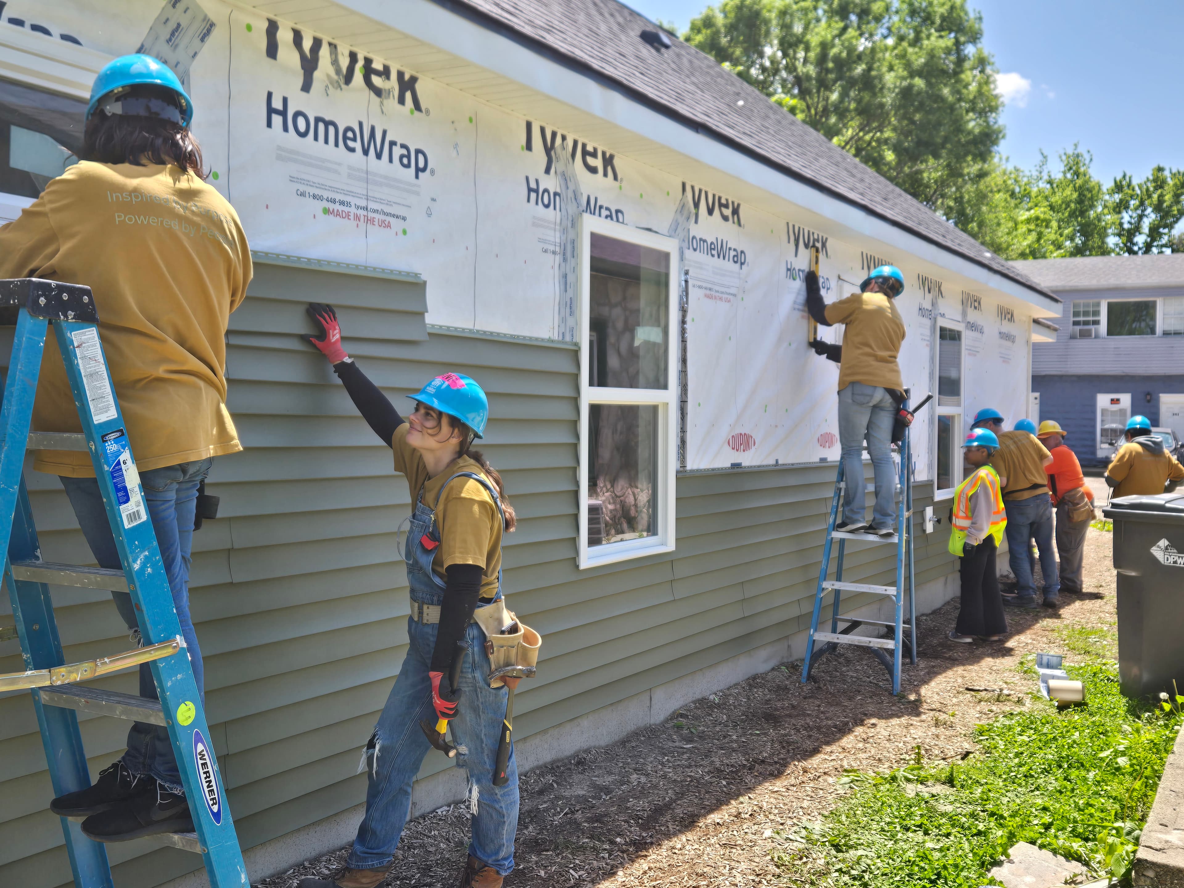 Volunteers working together at a community event